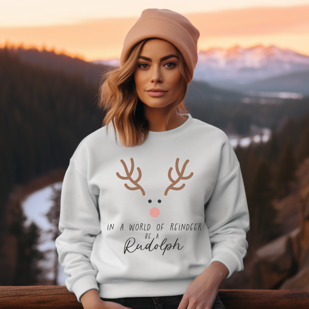 IN A WORLD OF REINDEER BE A RUDOLPH - Christian Unisex Sweater